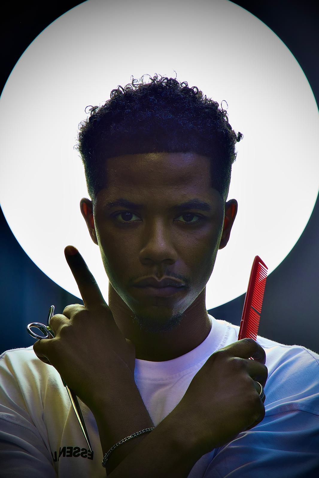 Experienced barber cutting hair at BRBER shop